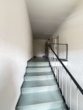 Treppenhaus - Leerstehende, gut ausgestattete Dreizimmerwohnung mit Balkon!