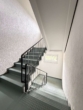 Treppenhaus - Leerstehende, gut ausgestattete Dreizimmerwohnung mit Balkon!